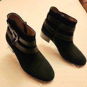 Ankle boots with leather strap accents. Side zip. No heel wear. Barely worn.